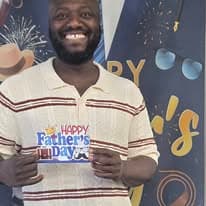 Man holding a Happy Father's Day sign